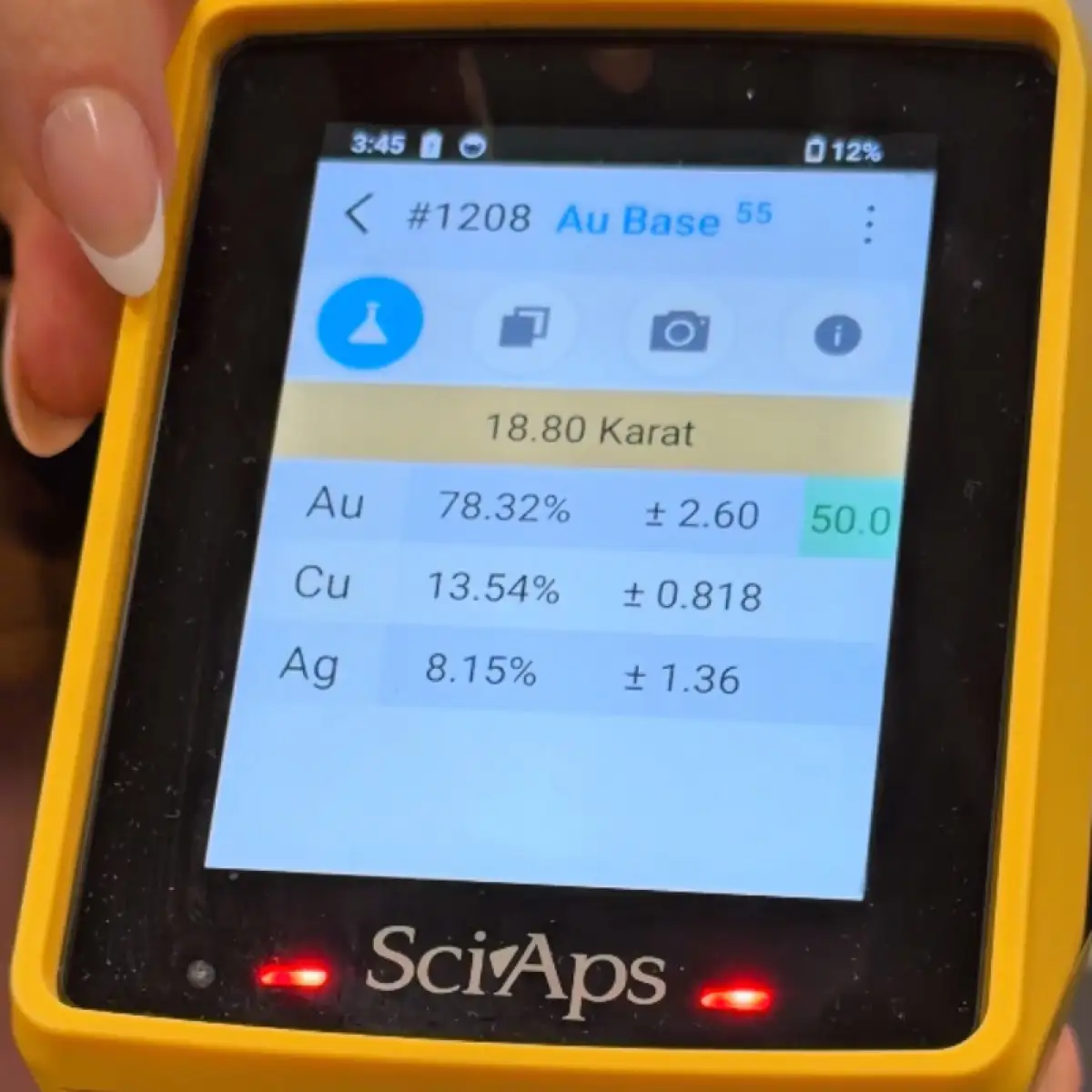 Handheld analyzer screen showing a live test result: 18.80 karat, 78.32% gold
